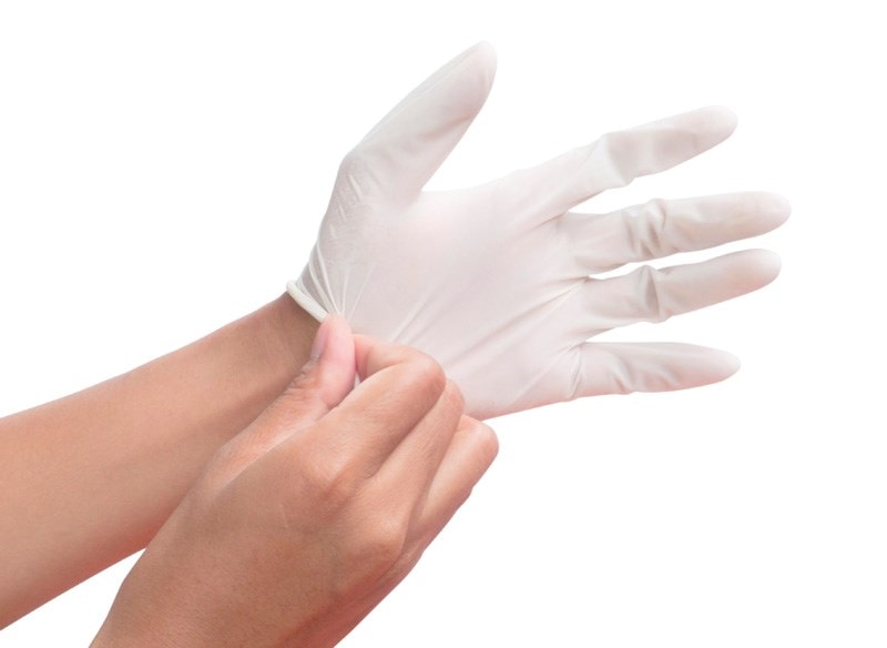 Putting on rubber glove