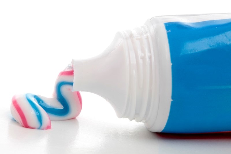 Toothpaste being squeezed from tube