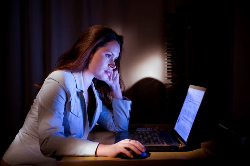 woman working on laptop at night