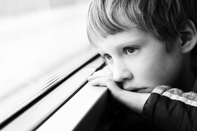 child looking out window 
