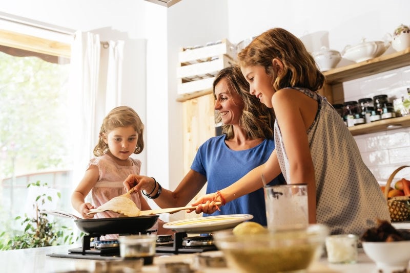 mother and daughters cooking 
