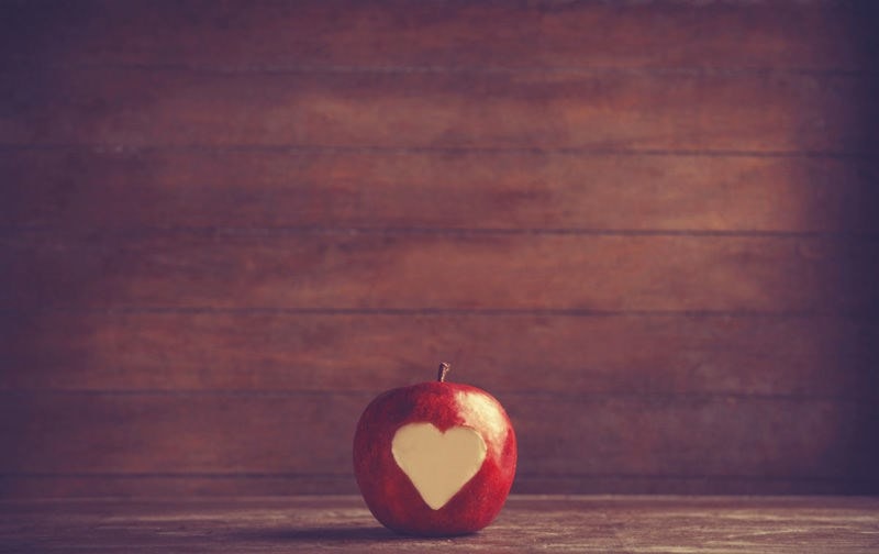 Apple with heart-shaped bite